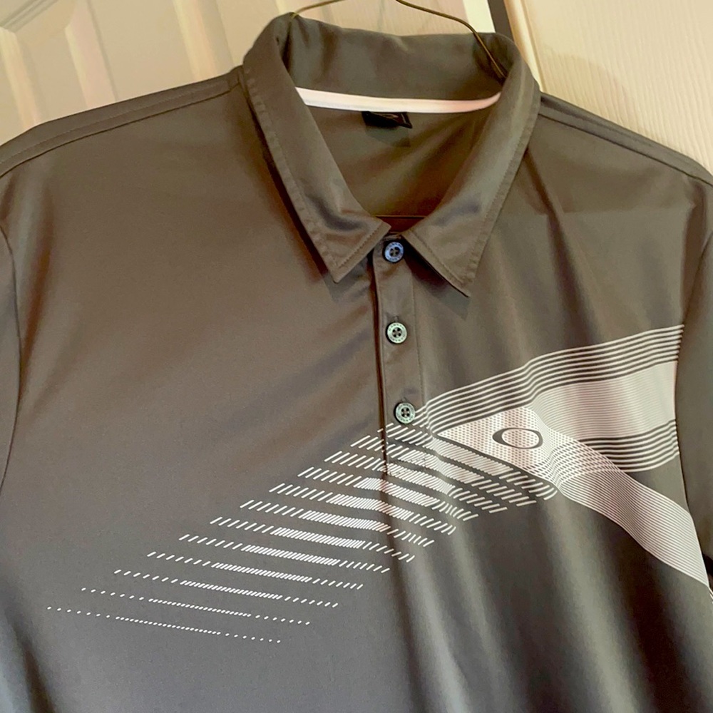 Well worn but wearable Oakley golf polo